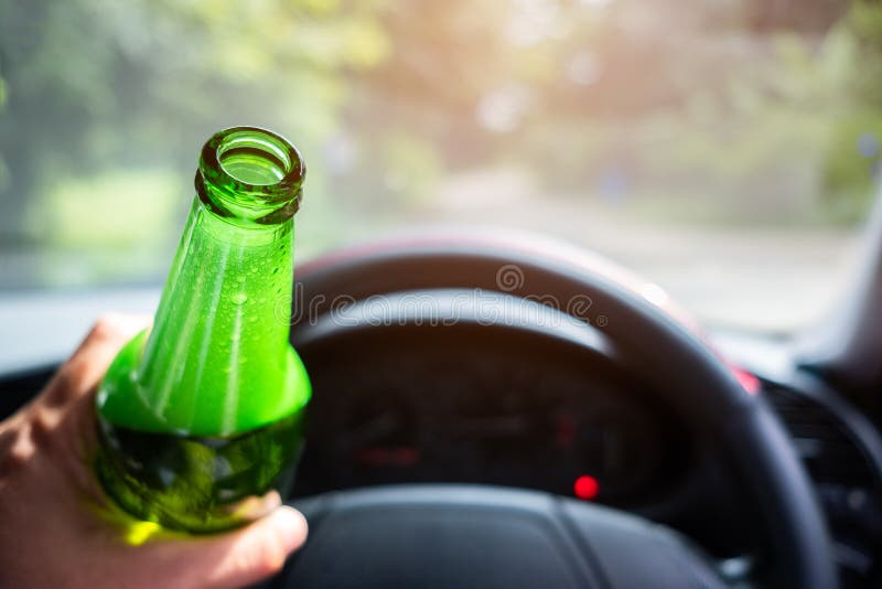 The Man Holding and Drinking Beer while Driving Car Stock Image Image