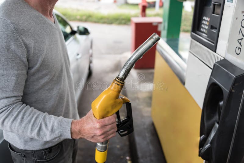 Man Holding A Fuel Pump Nozzle Stock Image Image of male, pump 62879059