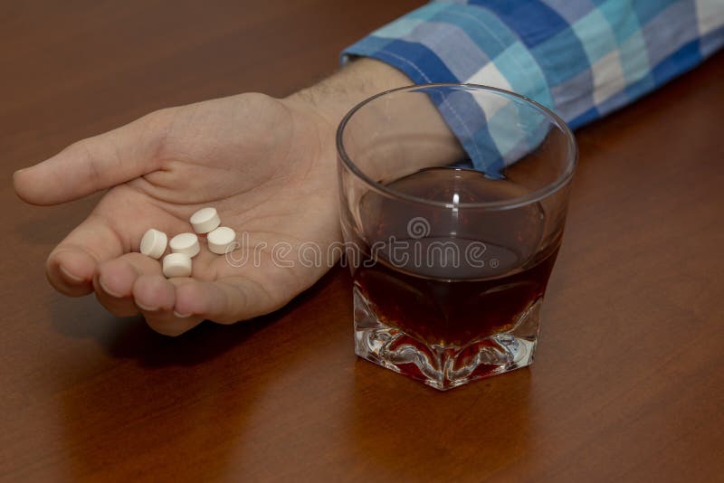 Tired Person Sleeping After Abuse of Alcohol and Drugs stock photography Tired Person Sleeping After Abuse of Alcohol and Drugs stock photography