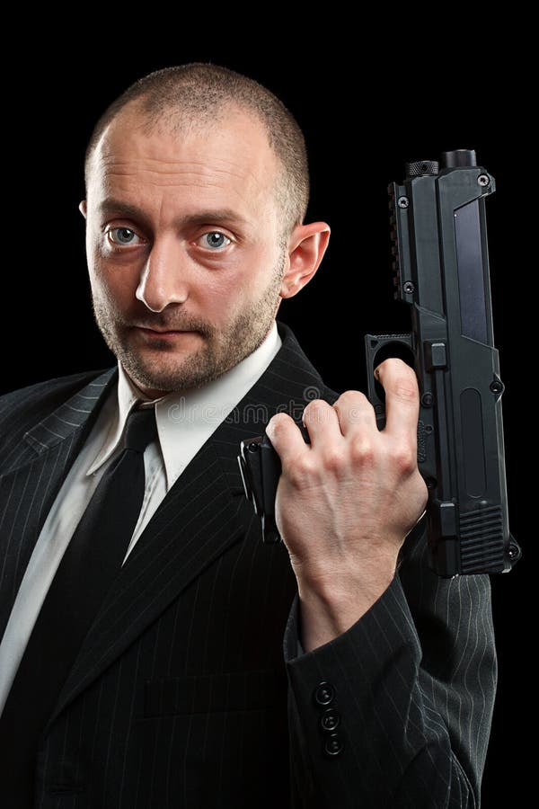 Man holding a gun stock image. Image of businessman, gunman - 25662159