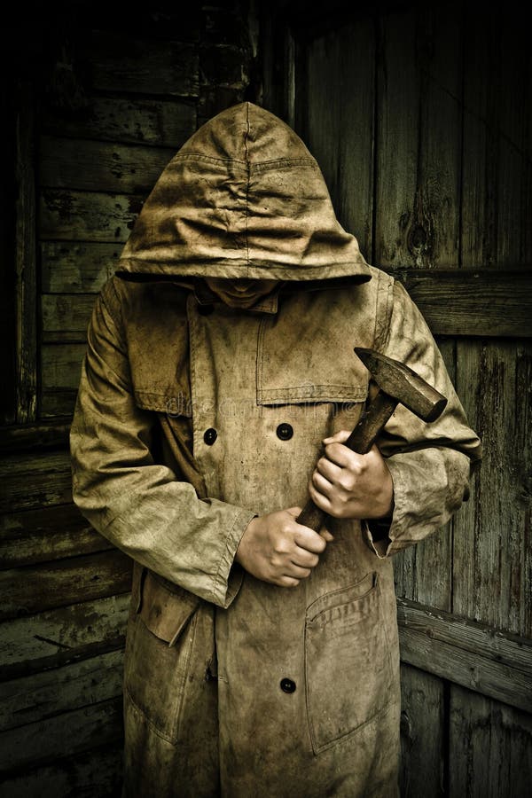 Man in Raincoat Holding Hammer Stock Photo Image of tool, wooden 26448644