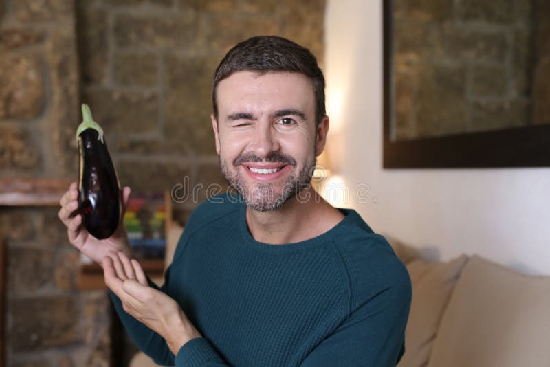 Man Holding a Large Eggplant Stock Image Image of food, aubergine