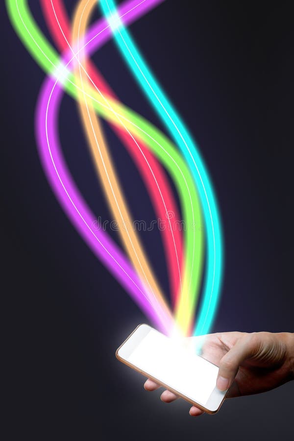 Man holding mobile phone and fiber optical light network. royalty free stock photo