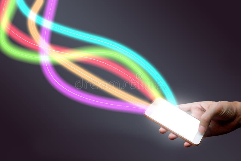 Man holding mobile phone and fiber optical light network. royalty free stock photos