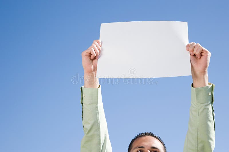 Miercoles (Wednesday in Spanish) Sign on white paper. Man Hand Holding  Paper with text. Isolated on sky background. Business concept. Stock Photo  Stock Photo - Alamy