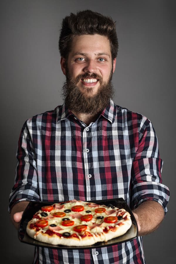 Man holding pizza stock photo. Image of cook, cheese 150045492