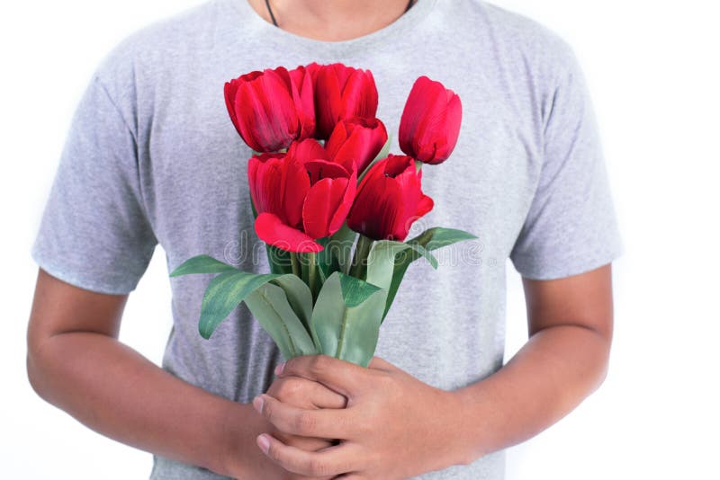 Man holding red rose flower. Valentines day and  Couples concept. Love and Flirting theme. Close up at rose. Body part and