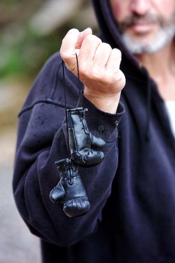 Man Holding Small Toy Boxing Gloves in His Hands Stock Image Image of