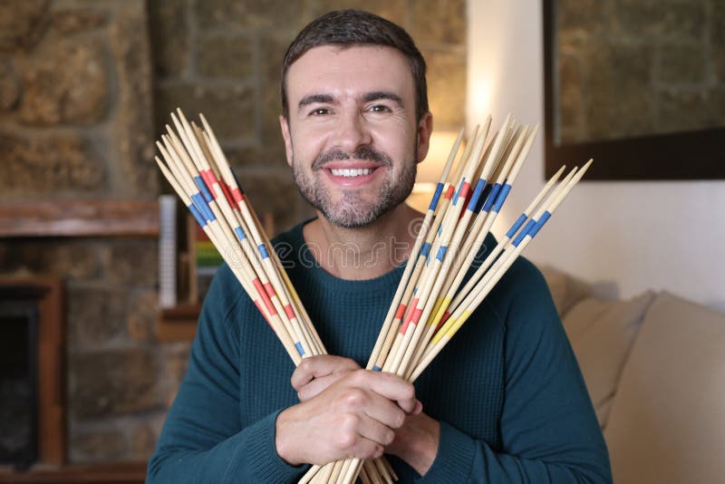 Man Holding Some Mikado Sticks Stock Image - Image of mikado, patience ...