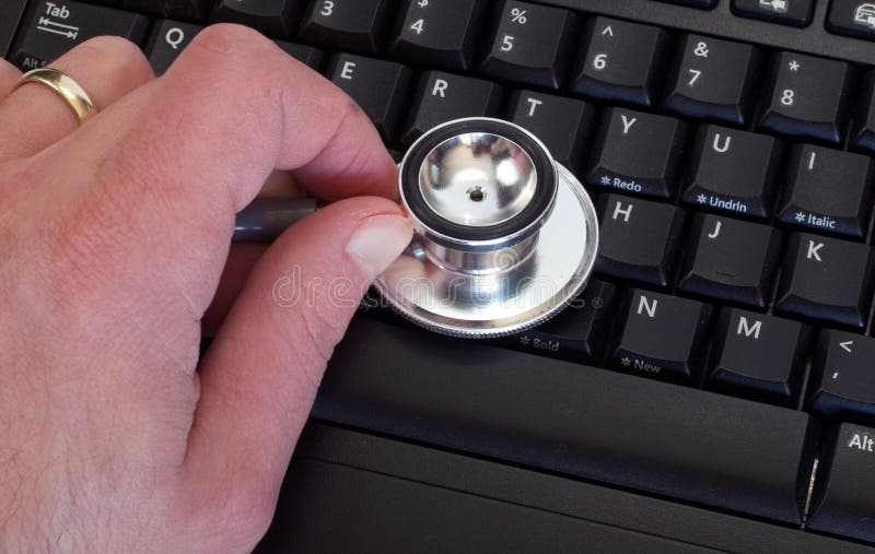 Man Holding Stethoscope on Keyboard