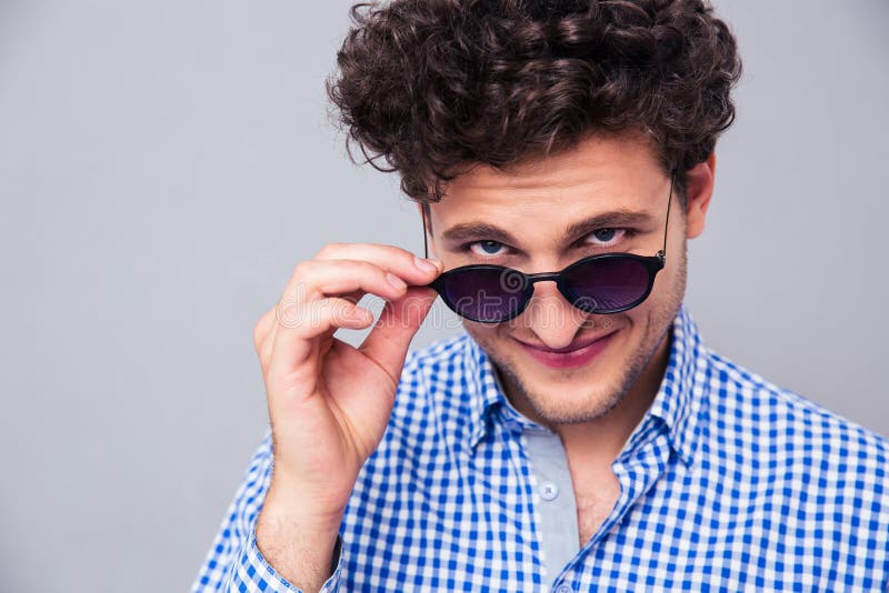 Man Holding Sunglasses and Looking at Camera Stock Image Image of