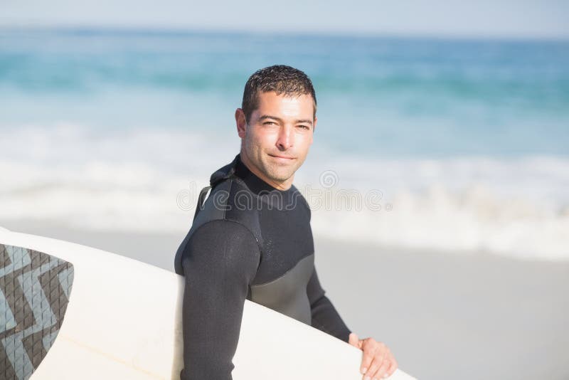 Man Holding Surfboard on the Beach Stock Photo - Image of summertime ...