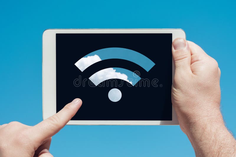 Man holding a tablet device showing wifi sign and touching the s royalty free stock images Man holding a tablet device showing wifi sign and touching the s royalty free stock images