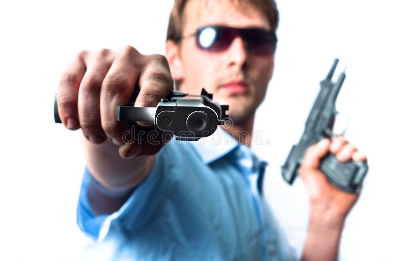 Man holding two guns in blue shirt