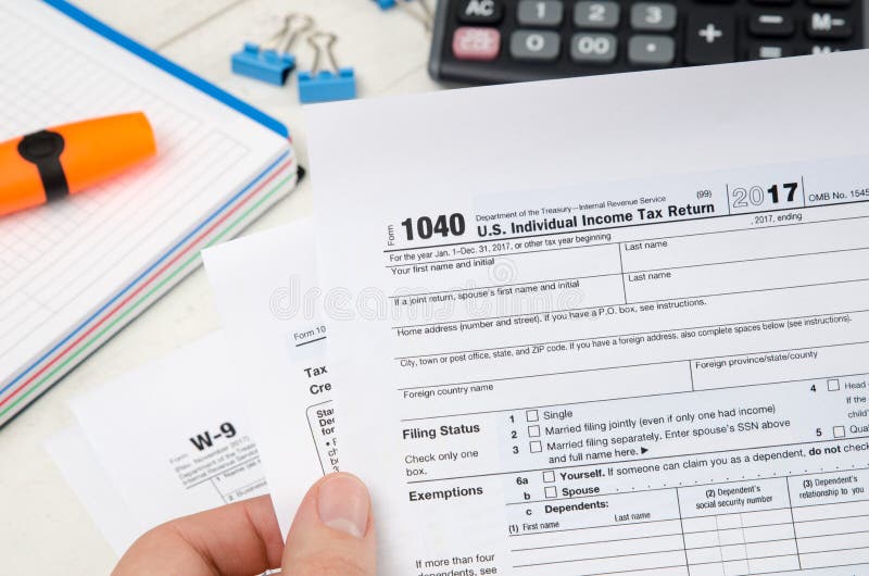 man holding us tax form 1040 editorial photo image of american first name and initial tax form
