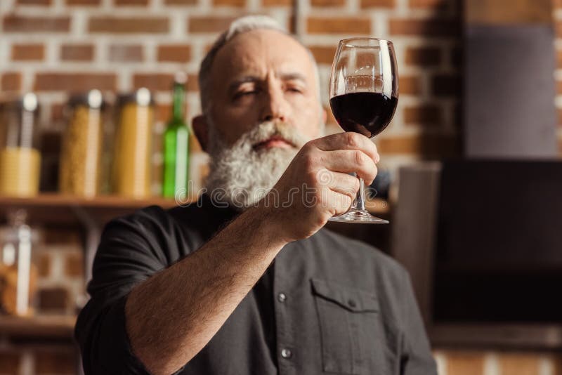 Man holding wine glass stock photo. Image of handsome 91845536