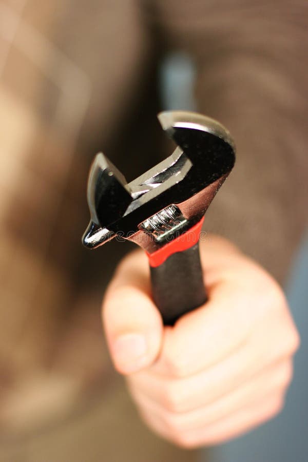 Man holding wrench stock photo. Image of spanner, adults 1795614