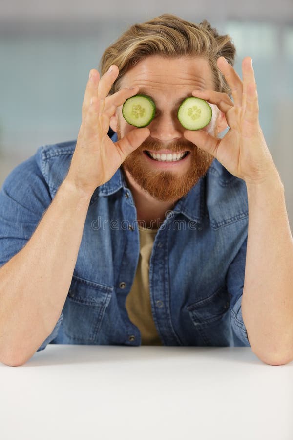 Man Holds Cucumber Slices Over Eyes Stock Image Image of camera