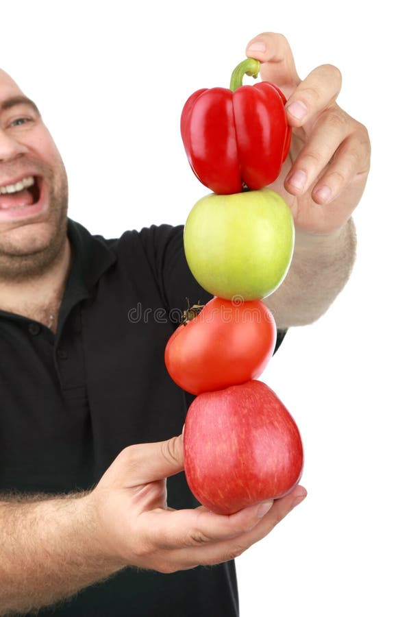 The man holds fruit