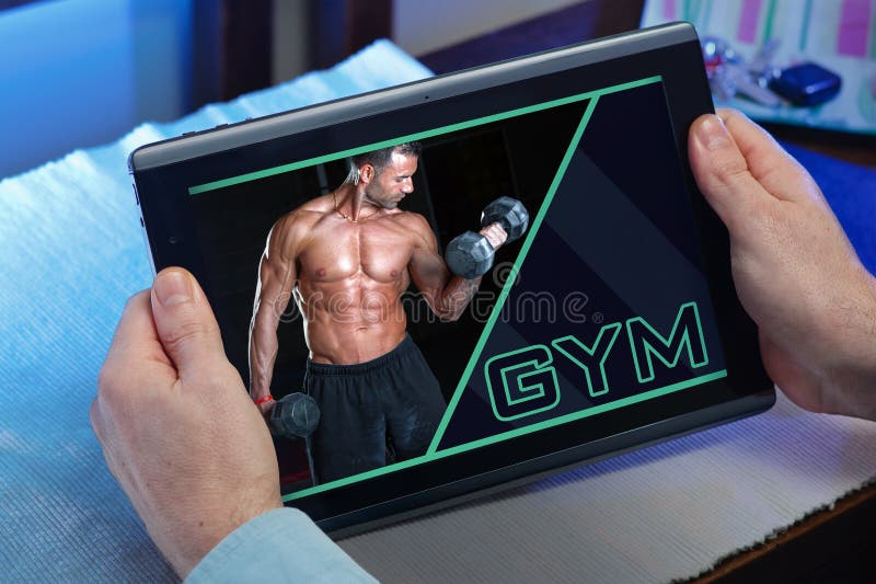 Man at home searching information in internet in gym website for stock image Man at home searching information in internet in gym website for stock image