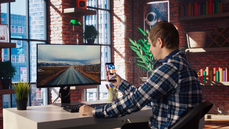 Man at home watching social media live broadcasts, interacting in chat royalty free stock photo