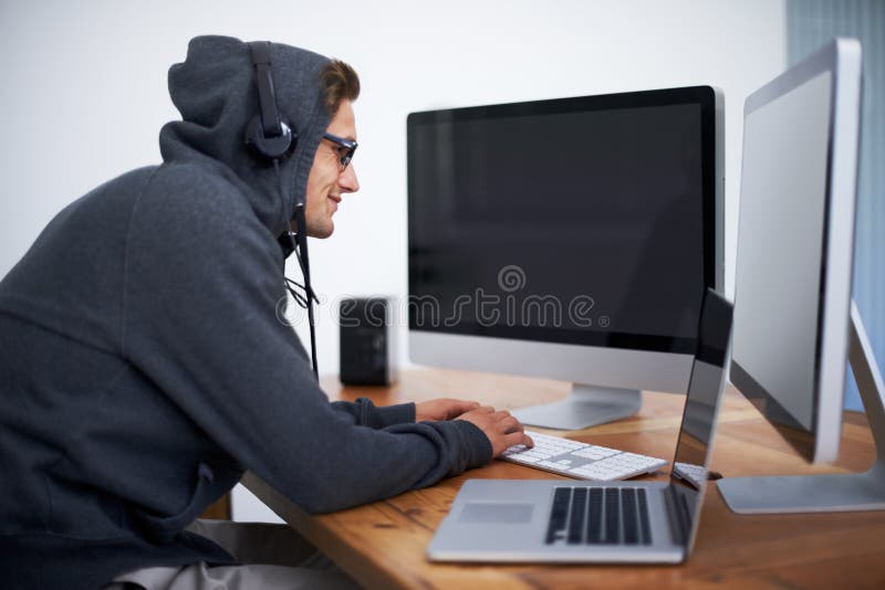 Man, hoodie and hacker on computer for digital information for password error, cyber security or database glitch. Male royalty free stock photography