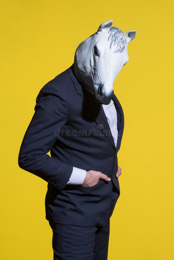 Man With Horse Mask On Yellow Background Stock Photo - Image of ...