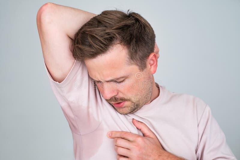 Man With Hyperhidrosis Sweating Very Badly Under Armpit Stock Image