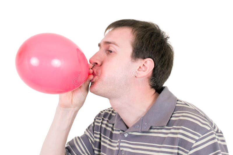 Man inflating red balloon