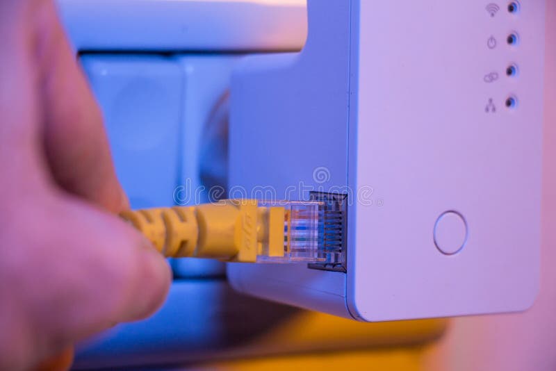 Man Insert Cable into WiFi Extender Device Which is in Stock