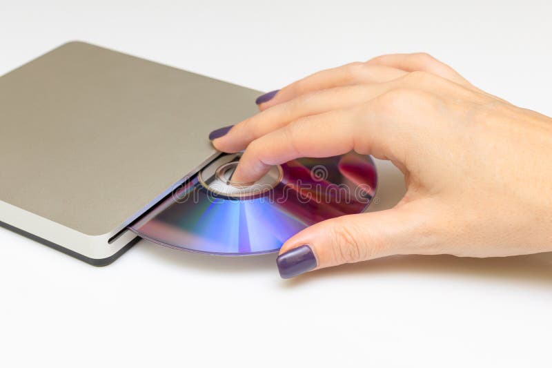 Man Inserting a Laser Disc into a Disk Drive Stock Image Image of