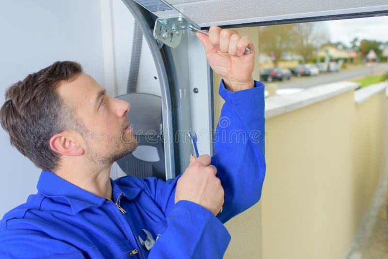 Man installing garage door