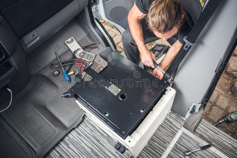 Top view of the installation of a swivel seat. DIY camper van conversion. Top view of the installation of a swivel seat. DIY camper van conversion.