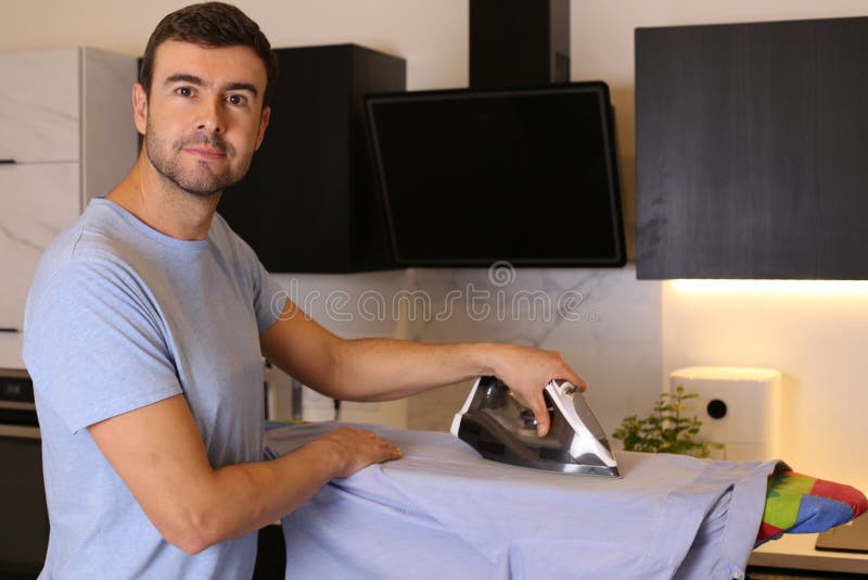 Man Ironing Clothes in the Kitchen Stock Photo Image of electrical