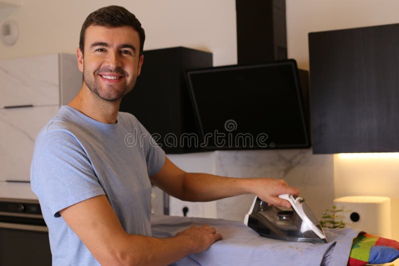 Man Ironing Clothes in the Kitchen Stock Photo Image of chores, cute