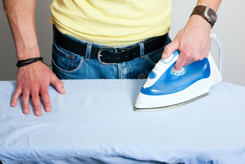 Man ironing a shirt stock image. Image of domestic, adult 12398713