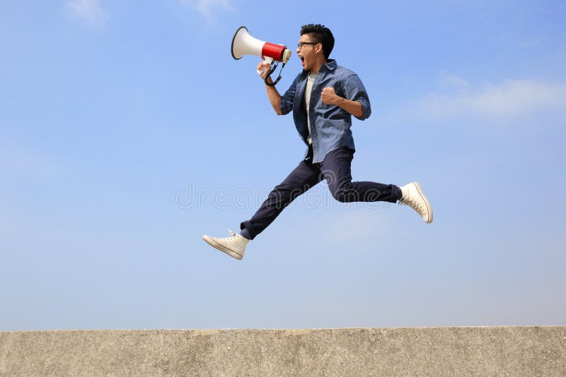 Man jump and shout megaphone