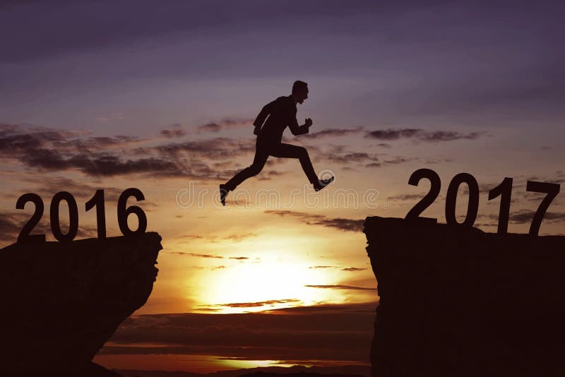 Man jumping on the hill toward 2017 royalty free stock images Man jumping on the hill toward 2017 royalty free stock images