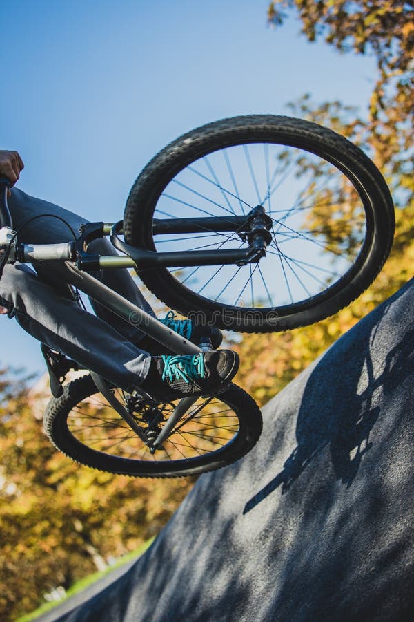 A Man Jumping with His Bicycle on a Pumptrack Park Stock Image Image