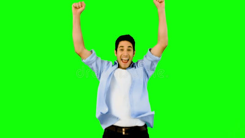 Man jumping for joy on green screen