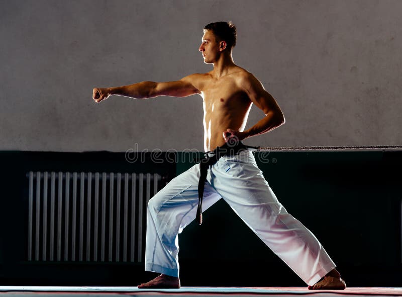 A Man, In A Black Kimono Is Practicing Martial Arts Technique With A Long  Bamboo Fighting Stick. Stock Photo, Picture and Royalty Free Image. Image  91980191.