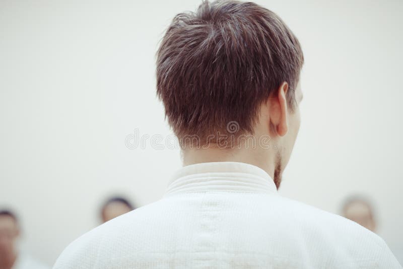 Man in kimono standing with her back royalty free stock photography