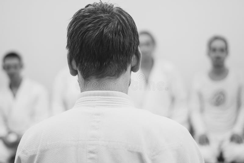 Man in kimono standing with her back stock image