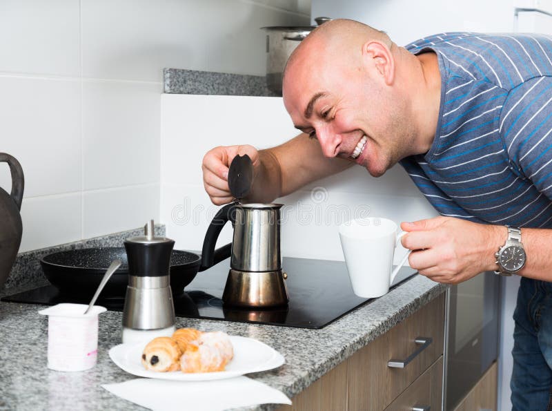 Man serving coffee from a moka pot Stock Photo by ©nito103 117806646