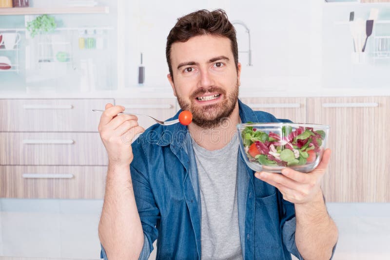 Young Man Portrait Dieting And Eating Fresh Salad Stock Image Image