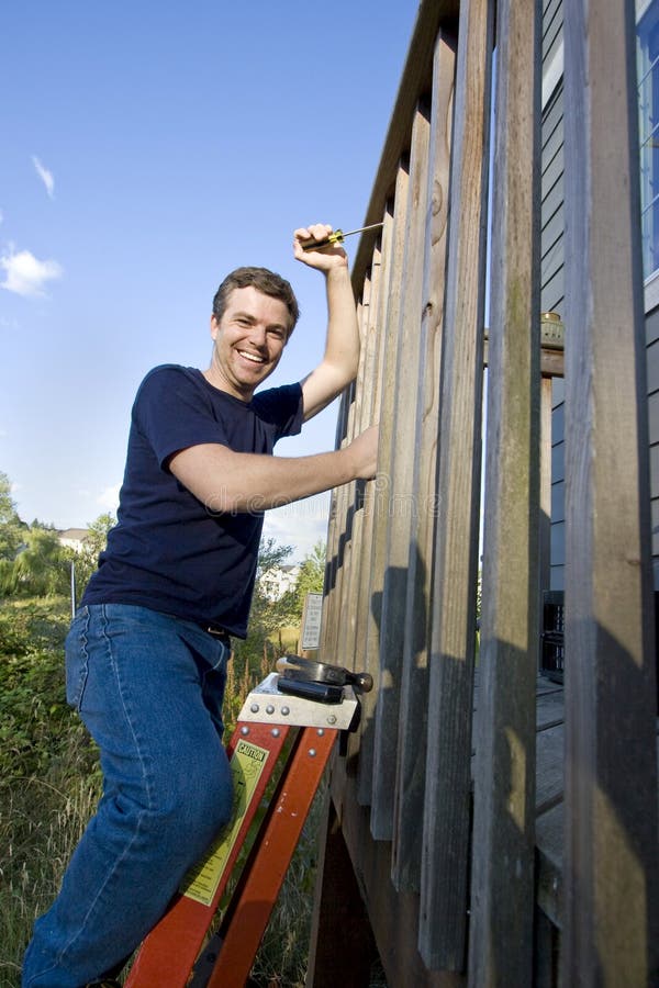 Man on Ladder - Vertical