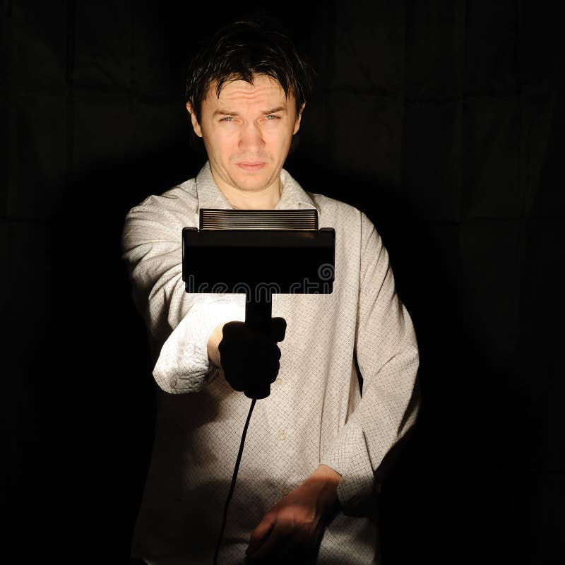 Man with lamp. stock photo. Image of contemporary, searchlight 15093976
