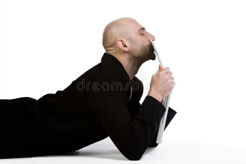 Man kissing his laptop computer. Laptop personal computer stock images, royalty-free photos and pictures