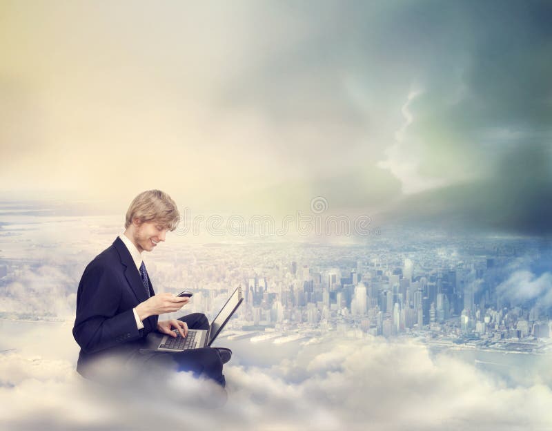 Young Business Man with Laptop and Phone on Top of the City