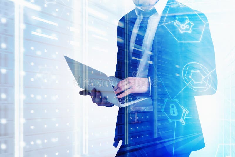 Man with laptop in server room, cyber security royalty free stock photography
